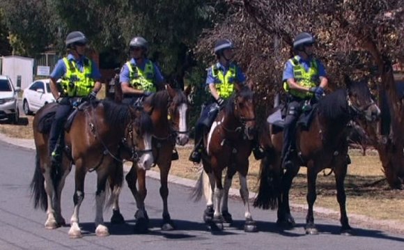 WA Police on horses patrol a