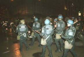 Citation: Police in riot gear, November 29, 1999.  Unprocessed Image Bank Negatives, Binder 990909-20000330, Sheet 1999. 991206.02 #15. Seattle Municipal Archives.