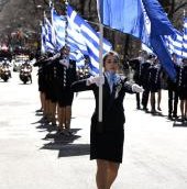 Students from the Hellenic College of Thessaloniki walk in the Greek Independence Day Parade.