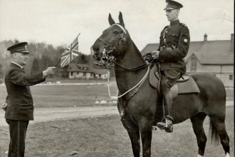 Sunnybrook farm was the scene of busy workouts in 1939,  as police worked to accustom mounts to every possible scare in preparation for the visit of King George VI and Queen Elizabeth. Shattering the quiet over Sunnybrook farm were the wailing of bagpipes,  the blasting of trumpets and the roaring of a radio,  accompanying the waving of flags.